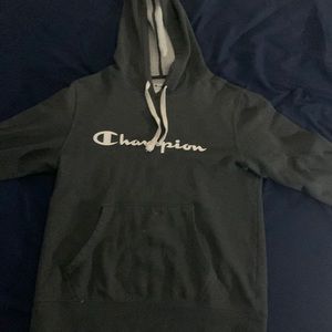 It is a champion sweater with a medium in girl size. gray and the inside.